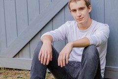 Yearbook photos at home in the fall. A boy with his dog. Class o