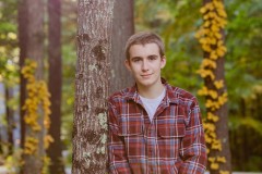 Yearbook photos at home in the fall. A boy with his dog. Class o