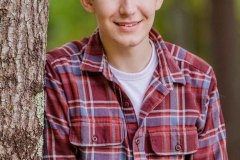 Yearbook photos at home in the fall. A boy with his dog. Class o