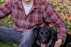 Yearbook photos at home in the fall. A boy with his dog. Class o