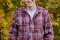 Yearbook photos at home in the fall. A boy with his dog. Class o