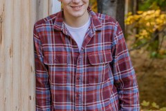 Yearbook photos at home in the fall. A boy with his dog. Class o