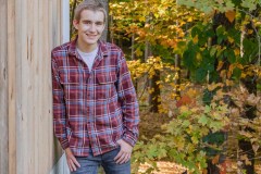 Yearbook photos at home in the fall. A boy with his dog. Class o