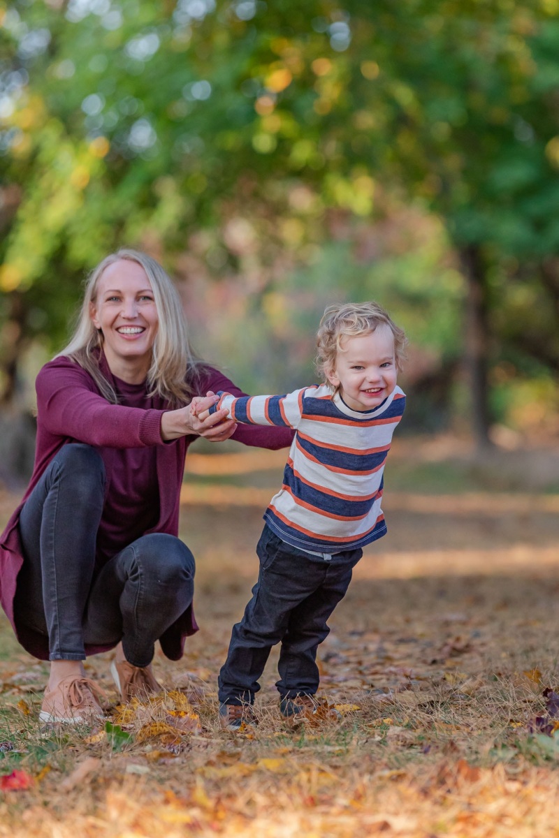 Mom , Dad and toddler son enjoy the scenery on a crisp fall monr