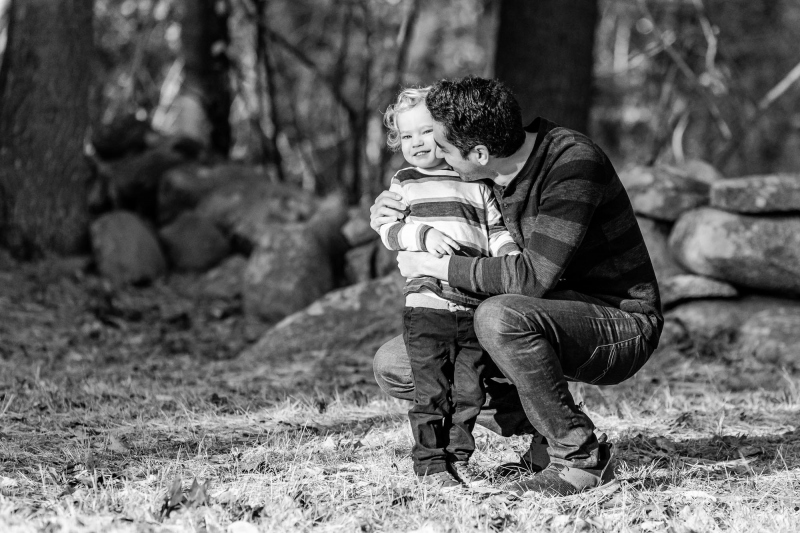 Mom , Dad and toddler son enjoy the scenery on a crisp fall monr