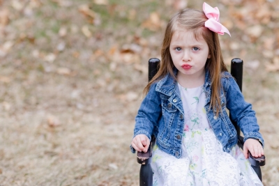 Baby Brother's First Birthday - Camp themed first birthday session - moose rocking chair - black and red plaid - big sister with pink bow