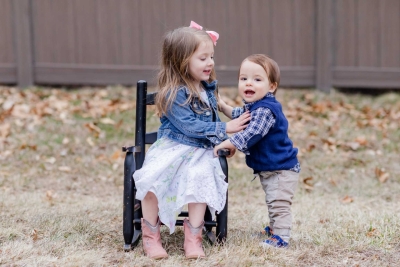 Baby Brother's First Birthday - Camp themed first birthday session - moose rocking chair - black and red plaid - big sister with pink bow