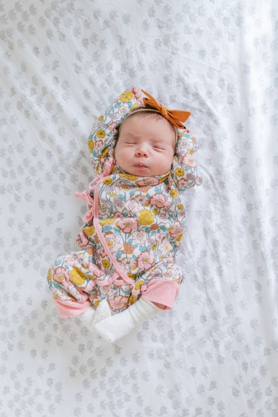 Family of three becomes a family of four with the addition of ba