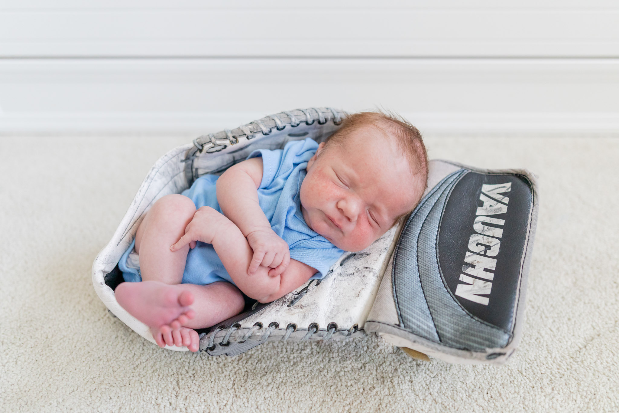 Southern NH First Birthday Baby in a Ice hockey Glove