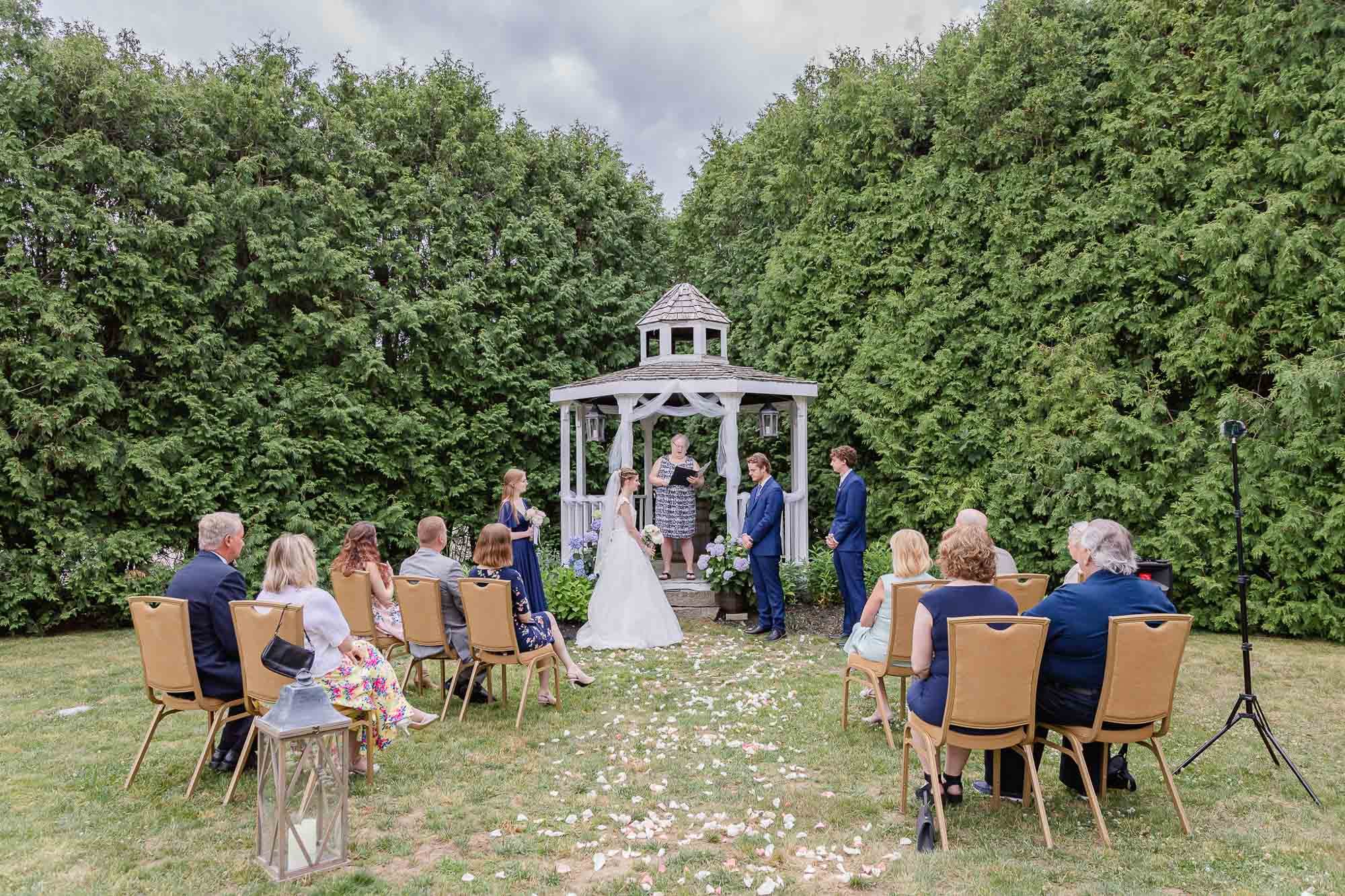 Small outdoor wedding ceremony at the Exeter Inn gazebo