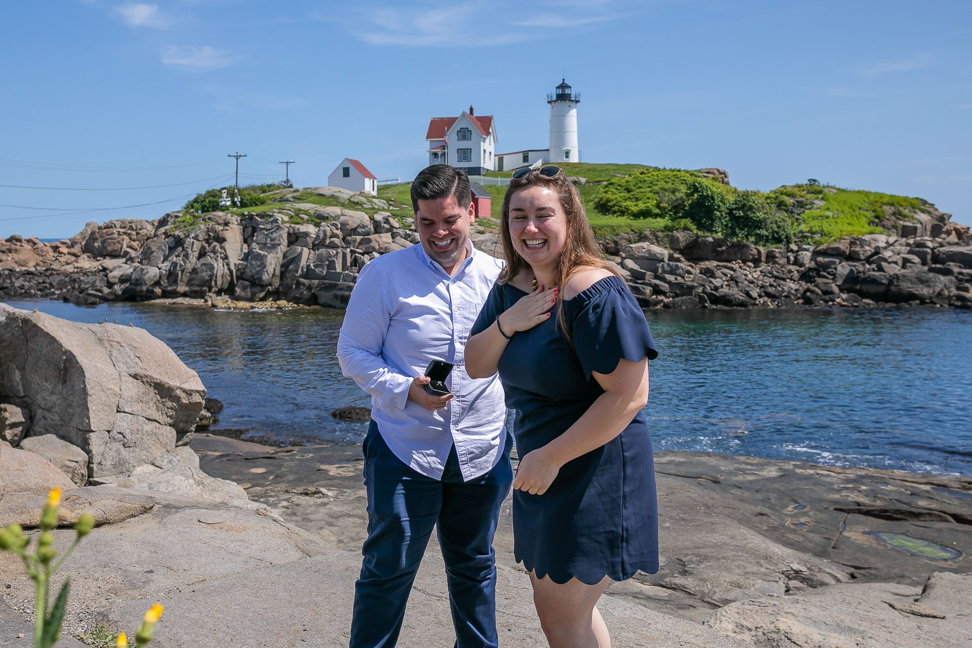 Surprise proposal and engagement session at Nubble Light in Maine.